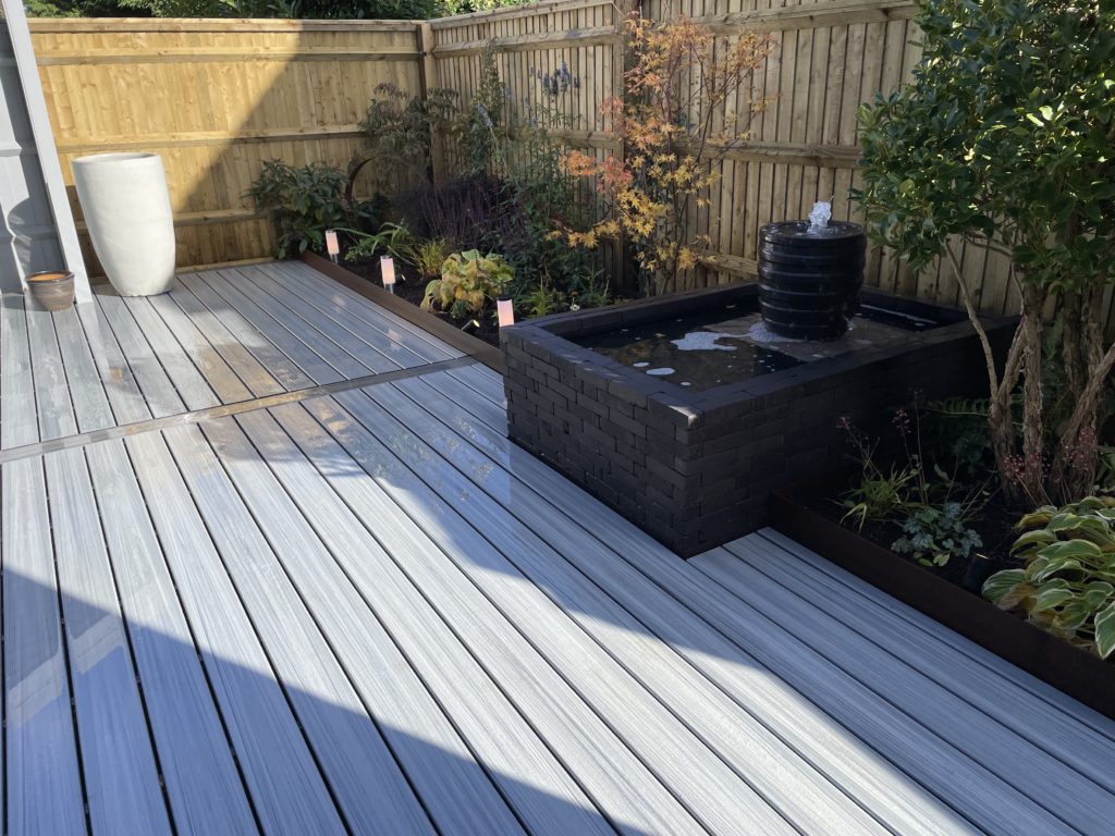 Composite decking with water feature