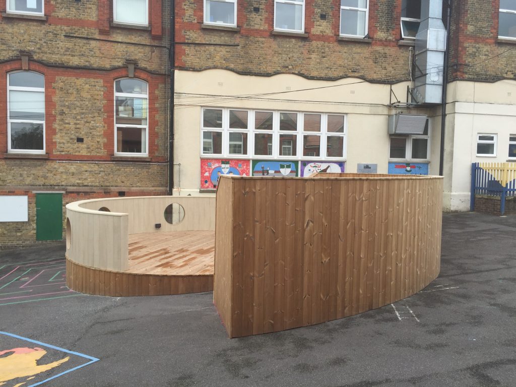 Curved decking platform for a playground