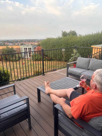 relaxing on his new deck in capel le fern