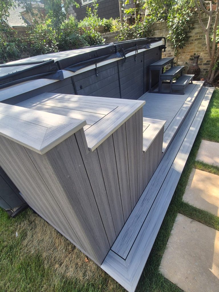 deckorators composite decking next to hot tub